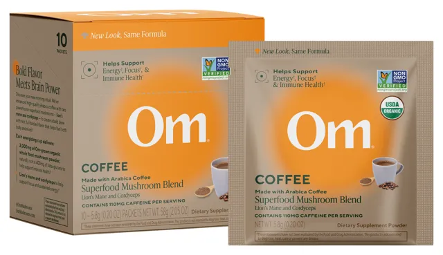 The Om Mushroom Coffee Blend box of ten single-serving packets beside one packet